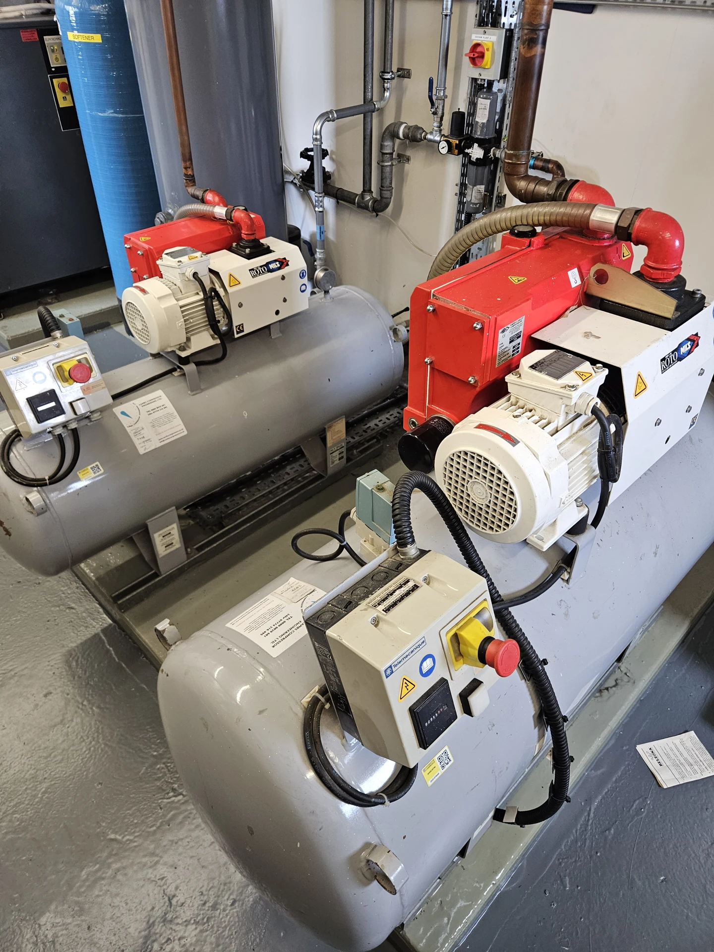 Vacuum pumps and pipework in an equipment installation